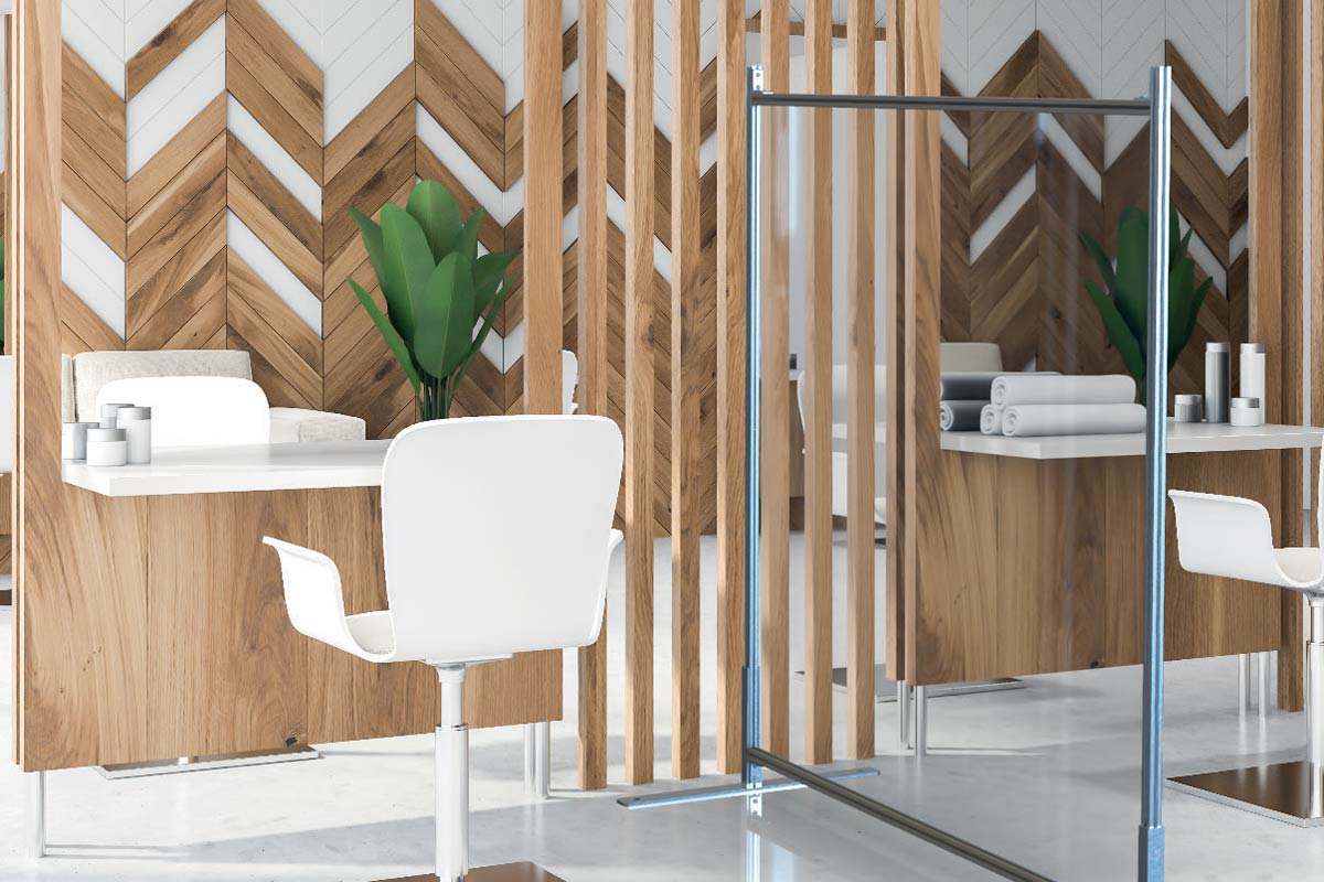 room with wood walls desks and a clear partition