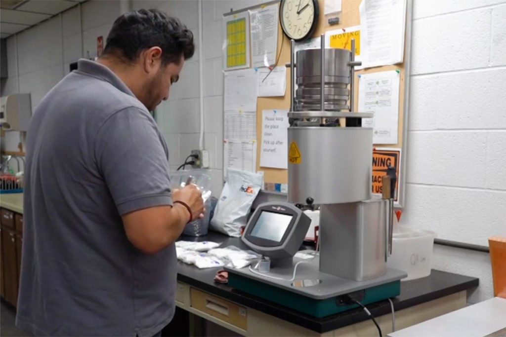 Lab technician labeling item
