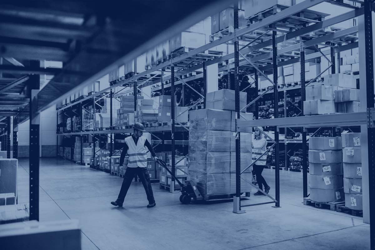 distribution center with worker pulling pallets