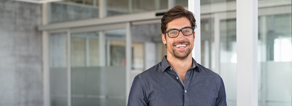 Man smiling in an office