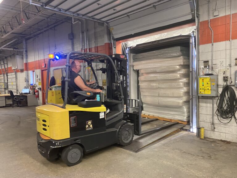 worker driving a forklift